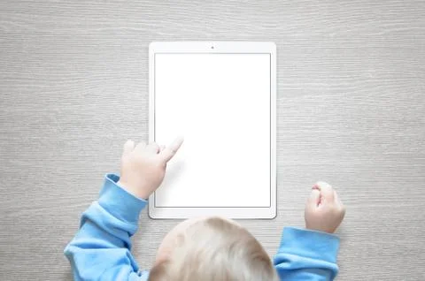 Kid learn to use tablet. Touch isolated screen for mockup. Stock Photos