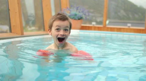 Kid learning how to swim in spa swimming pool 스톡 동영상 49762912