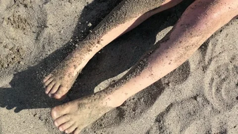 Kid legs moving on sand beach vacation Stock Footage 156854792