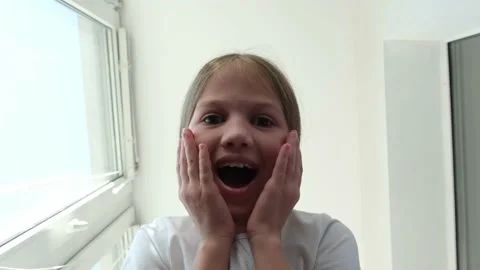 Kid looking into gift or delivery box, is surprised and happy. Merry Christmas Video stock 219458783
