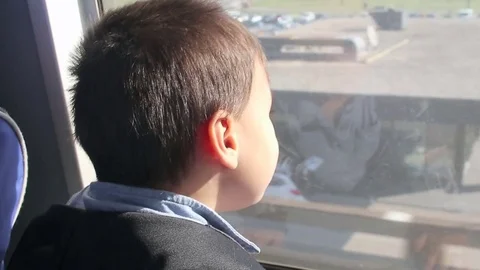 Kid looking out of train window Stock Footage 81670693