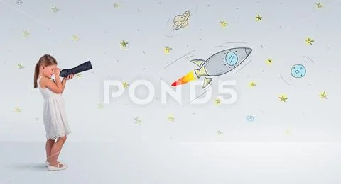 Kid looking through spyglass to imaginary rockets Stock Photos