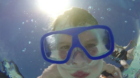 Kid looking underwater in camera with goggles Stock-Footage 50238854