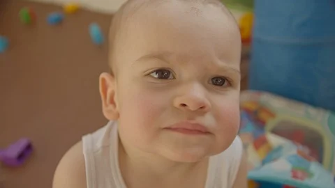 The kid looks at the camera close plan. sunny day Stock Footage 114614040