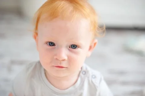 The kid looks closely at the camera Stock Photos