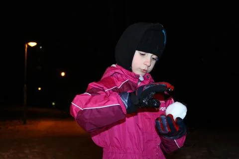 Kid make snowball Stock Photos