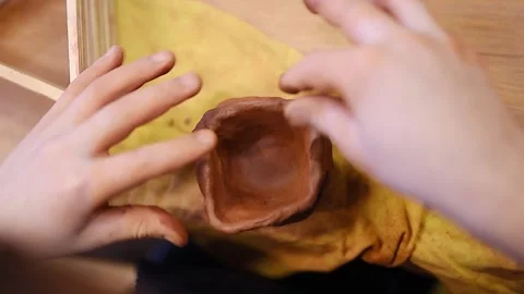 Kid making cup with pottery clay Stock Footage 152725937
