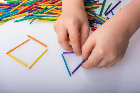 Kid making rectangular and triangle shape as creative concept 스톡 사진