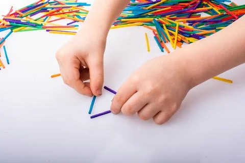 Kid making triangle shape on as creative concept 스톡 사진