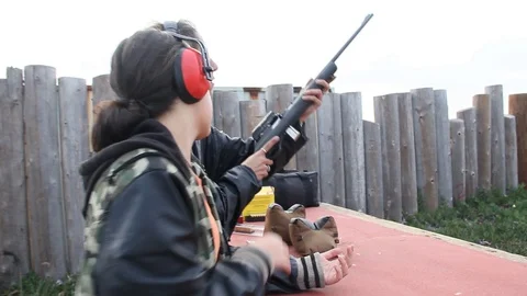 Kid messes with her gun Stock Footage 114212143