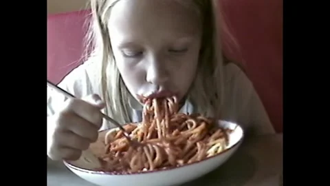 Kid with messy face after eating spaghetti Stock Footage 330270287