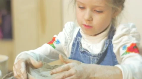 Kid is Molding an Edges of Clay Circle Sculpting a Vase Little Blonde Girl is Stock Footage 59124769