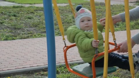 Kid with mom on the playground Stockbeeldmateriaal 59864435