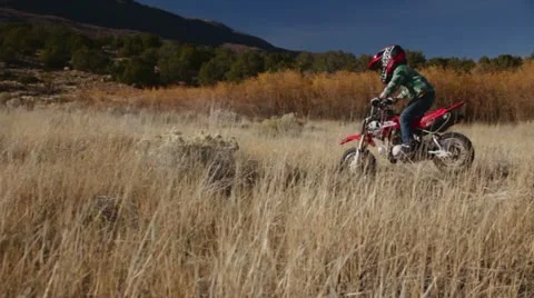 Kid on motorcycle HD9283 Stock Footage 12541601