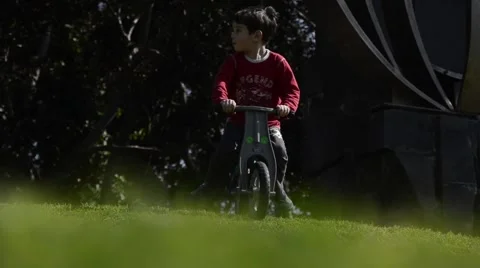 Kid move down the hill by bicycle Stock Footage 47598535