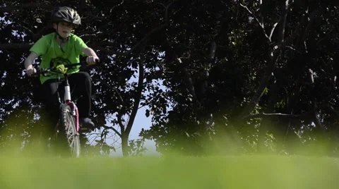 Kid move down the hill by bicycle Stock Footage 47598581