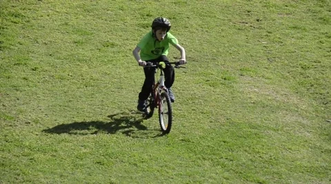 Kid move down the hill by bicycle Stock Footage 47598637