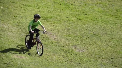 Kid move down the hill by bicycle Stock Footage 47598651