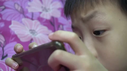 A kid move its mobile phone Stock Footage 161811264