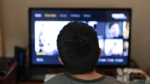 Kid Navigating  and Watching Amazon Prime on Monitor Stock Video Stock Footage 57374037