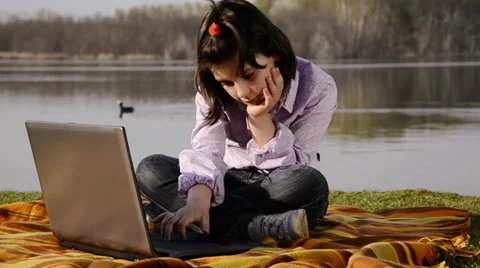 A kid, a notebook and a lake Video stock 33195818