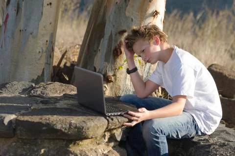 Kid with notebook Stock Photos