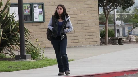 Kid pacing while waiting at school Stock Footage 155387007