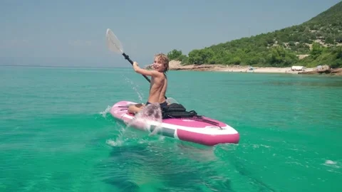 Kid on paddle board. Stock Footage 202636979