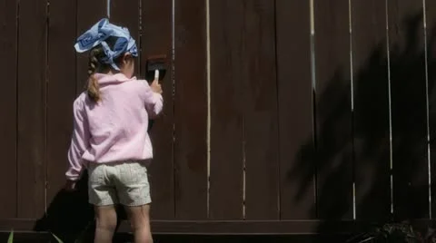 Kid painting fence Stock Footage