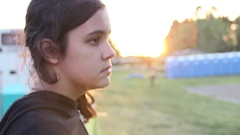 Kid in park with the sun setting Stock Footage 154992323