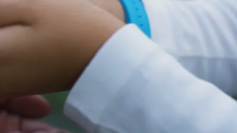Kid passes redcurrant berries into hands of adult Stock Footage 108736546