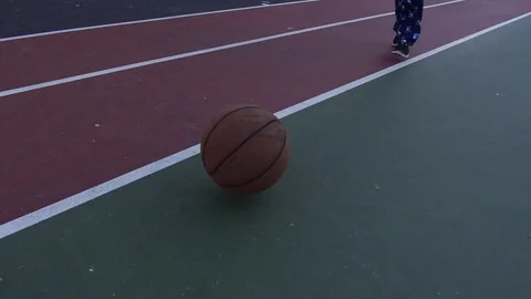 Kid Picking Up Basketball Stock Footage 81226461