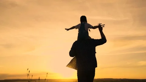 Kid, pilot sits on his dads shoulders in pilots goggles. Teamwork father, child Video stock 181893801