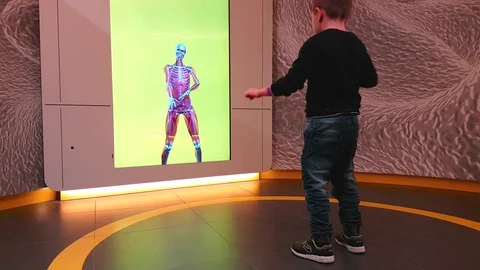 Kid play with Innovative Cybernetic System Stock Footage 83703150