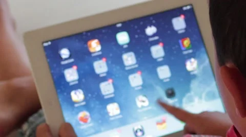 Kid play iPad , seen from Above Stock Footage 40751819