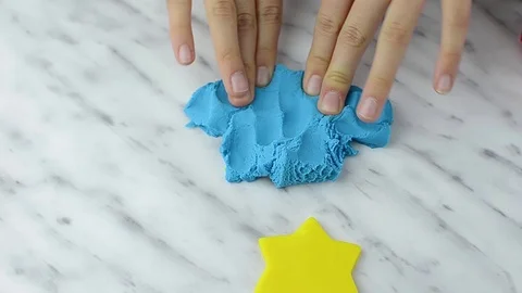 Kid  play with modeling clay at light living room. Stock Footage 104853267