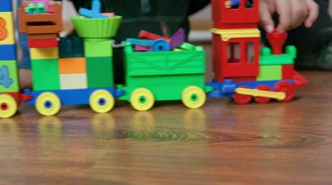 Kid play with a toy train Stock Footage 44551427