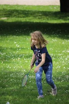 Kid playing badminton Stock Photos