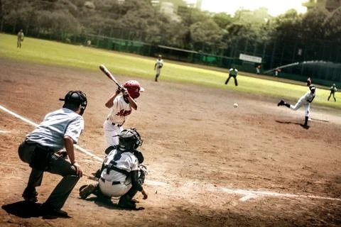 Kid playing baseball Stock Photos