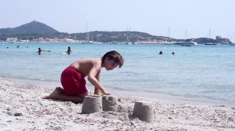 Kid playing on the beach Stock Footage 44445701