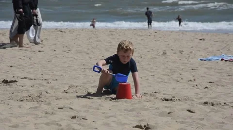 Kid playing on beach Stock Footage 45910789