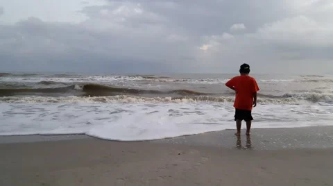 Kid playing at the beach Stock Footage 58701537