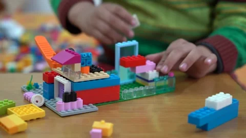 Kid playing with blocks Stock Footage 146157642