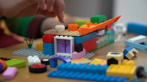 Kid playing with blocks Stock Footage 146157657