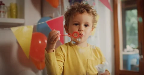Kid Playing with Bubble Bottle at Party Stock Footage 231481333