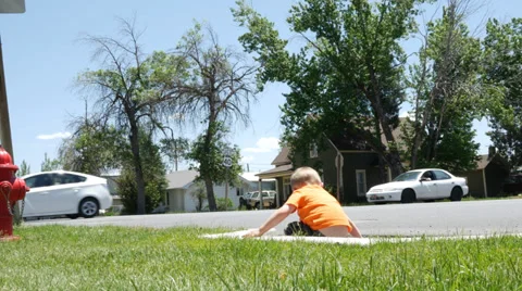 Kid Playing By Busy Road. Stock Footage 39303520