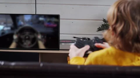 Kid playing console video game Stock Footage 267420341