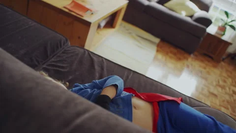 Kid playing on the couch Stock Footage 279184373