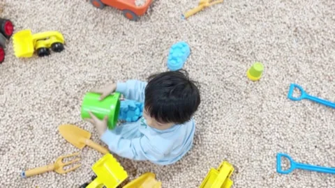 A kid playing on the Cypress Wood Cube, slow motion Stock-Footage 262865720