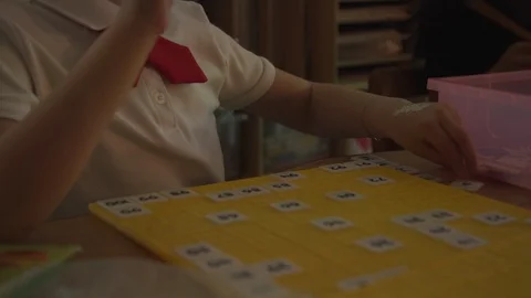 KID PLAYING EDUCATIONAL BOARD GAME Stock Footage 94428248